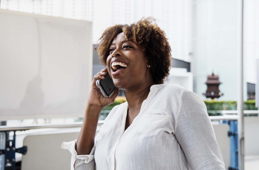 Happy woman talking on the phone